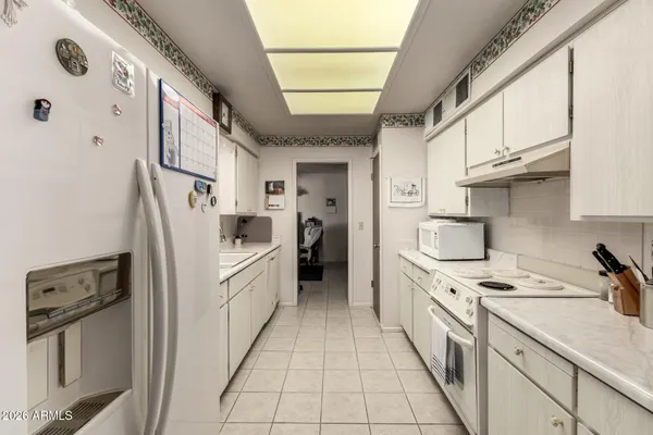 a view of a a dining room with furniture window and outside view
