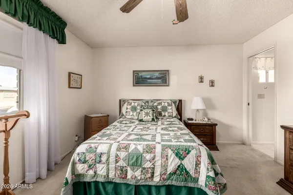 a bed room with a bed and a television