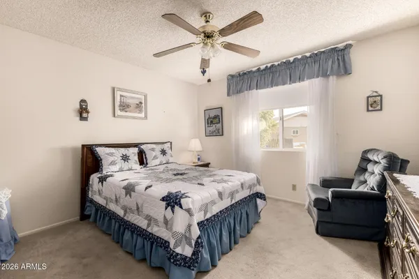a bathroom with a sink toilet and mirror
