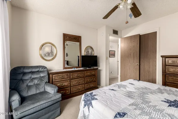 a bedroom with bed and window