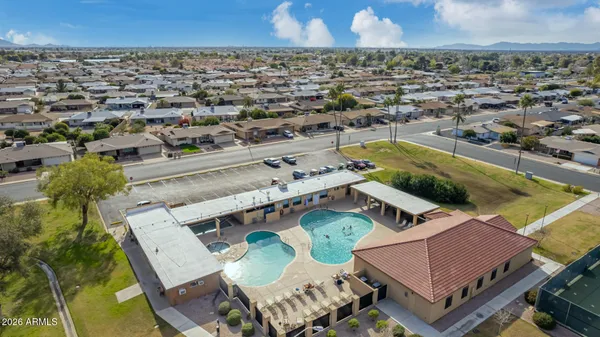 an aerial view of a house with a swimming pool