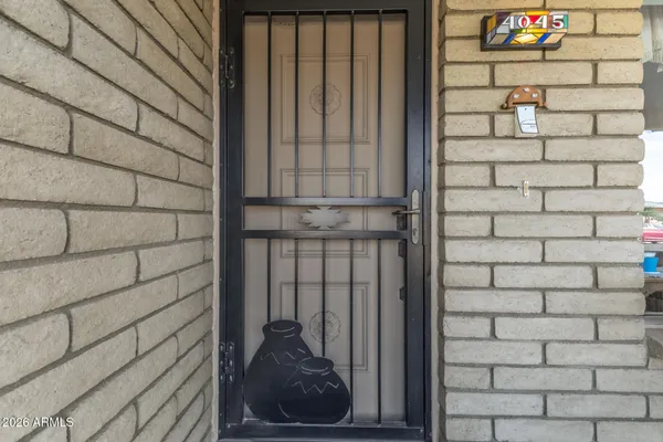 a view of a white house with a yard