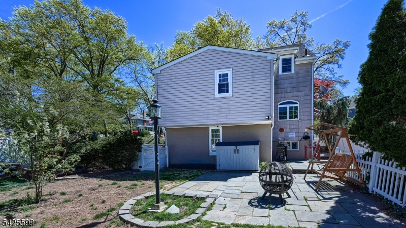 178 Jackson Avenue Rutherford, NJ 07070 - Photo 28 of 29 a front view of a house with garden