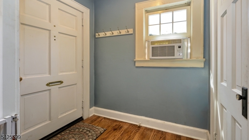 178 Jackson Avenue Rutherford, NJ 07070 - Photo 4 of 29 a view of an empty room with wooden floor and a window