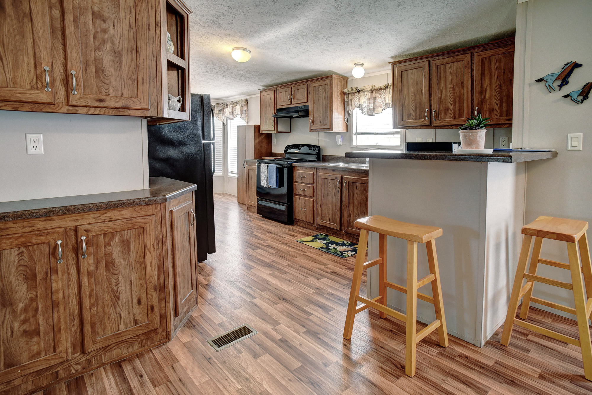 4495 Taylorsville Road Red Rock, TX 78662 - Photo 11 of 40 The open flow between the kitchen, dining area, and living room make it easy to stay connected while multitasking.