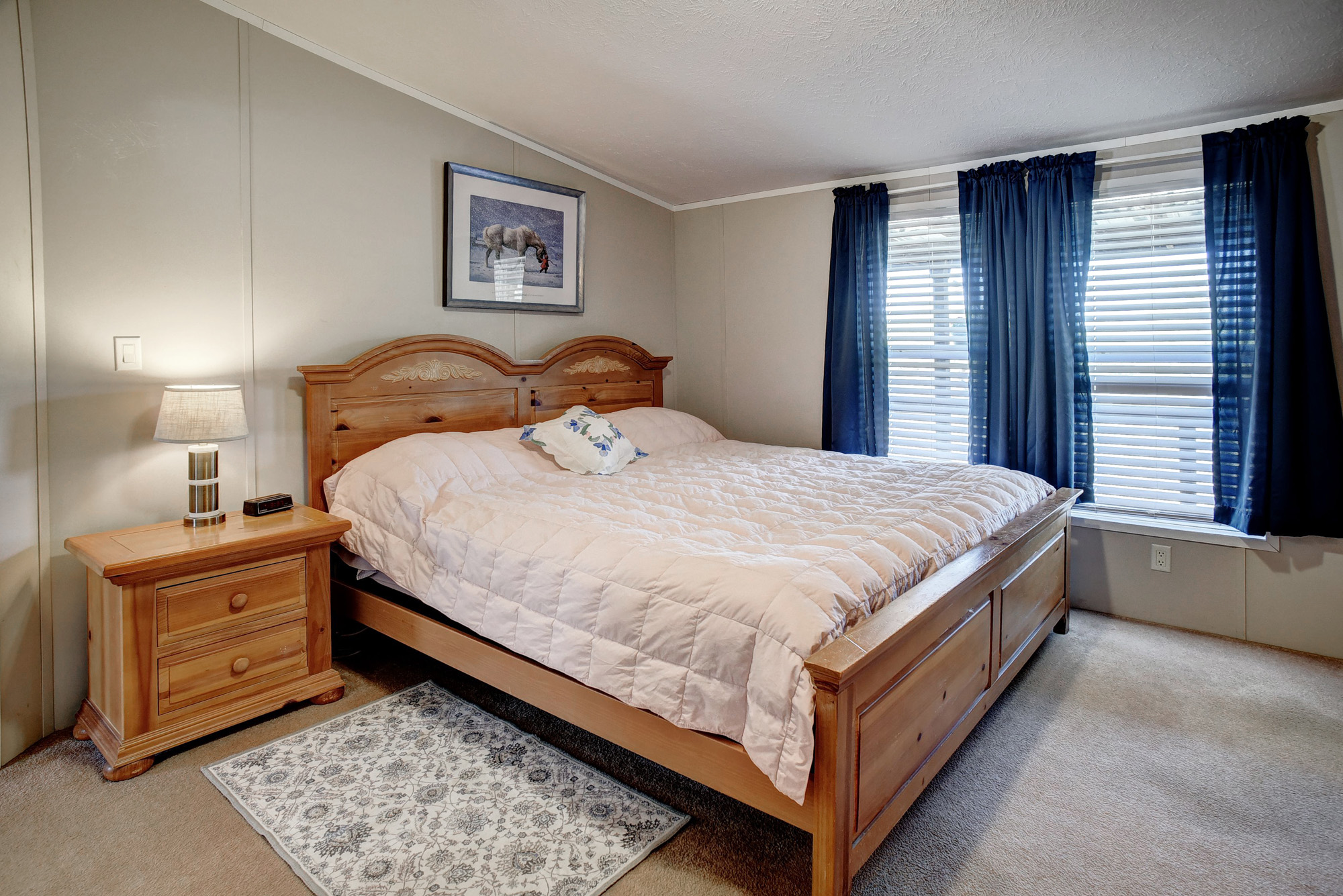 4495 Taylorsville Road Red Rock, TX 78662 - Photo 17 of 40 The primary bedroom offers plenty of space to reflect and relax at the end of the day.