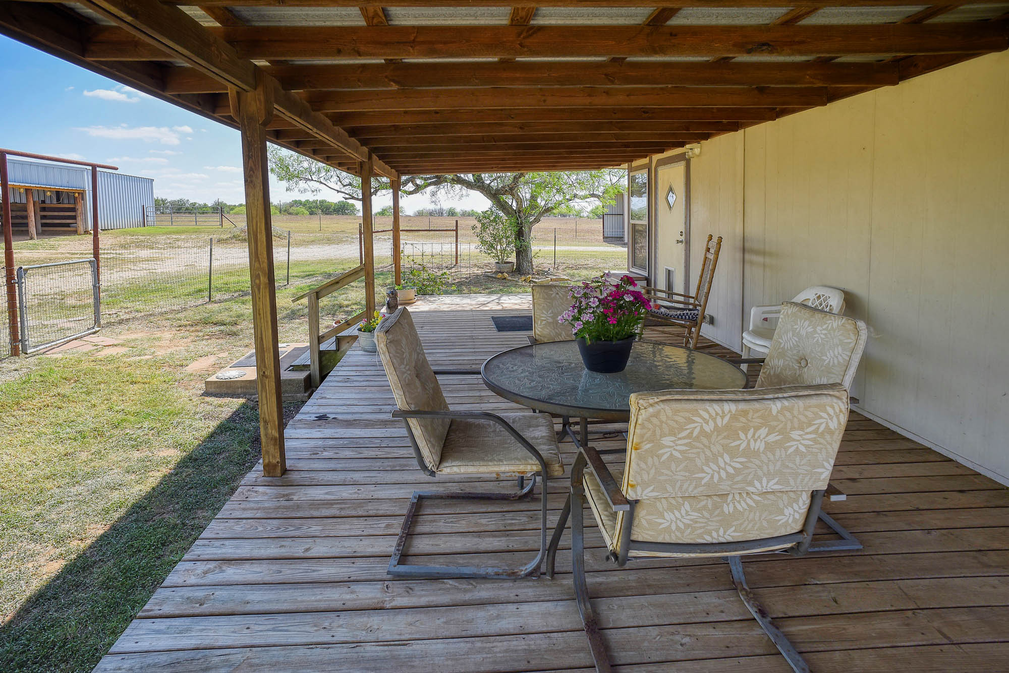 4495 Taylorsville Road Red Rock, TX 78662 - Photo 29 of 40 Nothing like enjoying a beverage while listening to the rain fall on the metal roof above.