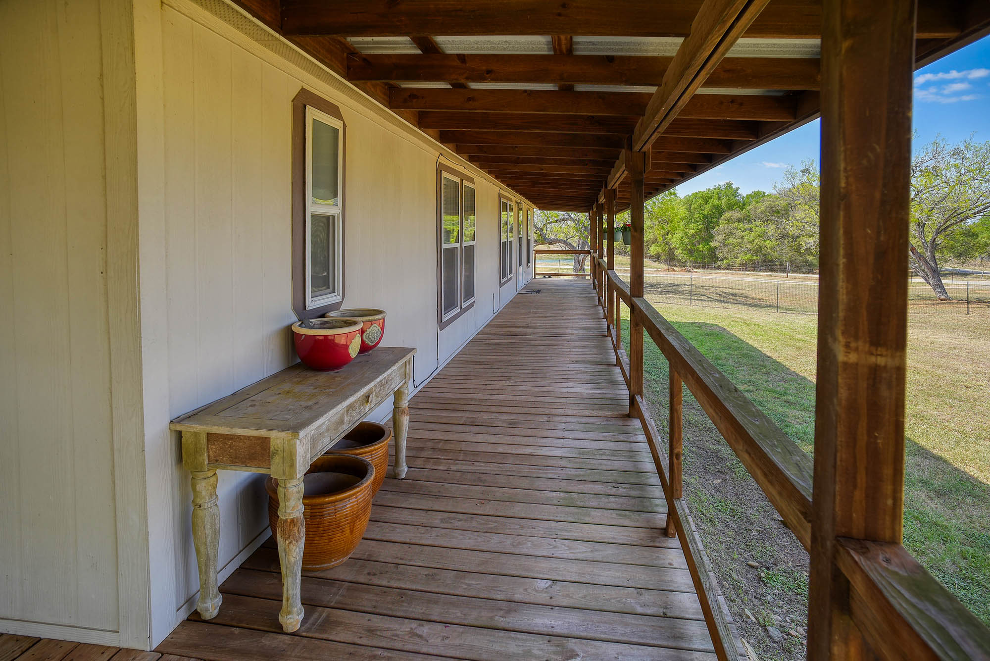 4495 Taylorsville Road Red Rock, TX 78662 - Photo 30 of 40 Here's your spot for watching front yard activities in the shade!