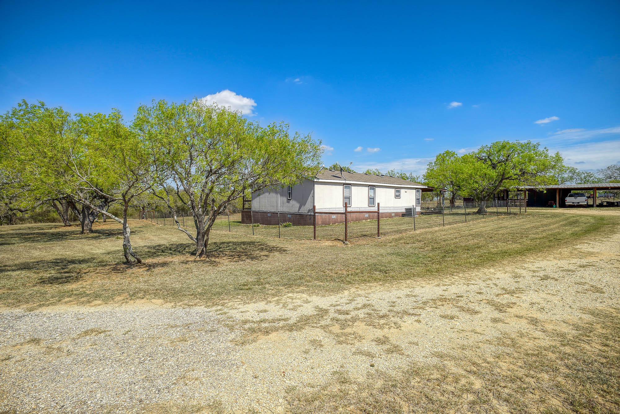 4495 Taylorsville Road Red Rock, TX 78662 - Photo 36 of 40 Few trees mean some shade and less to maintain.