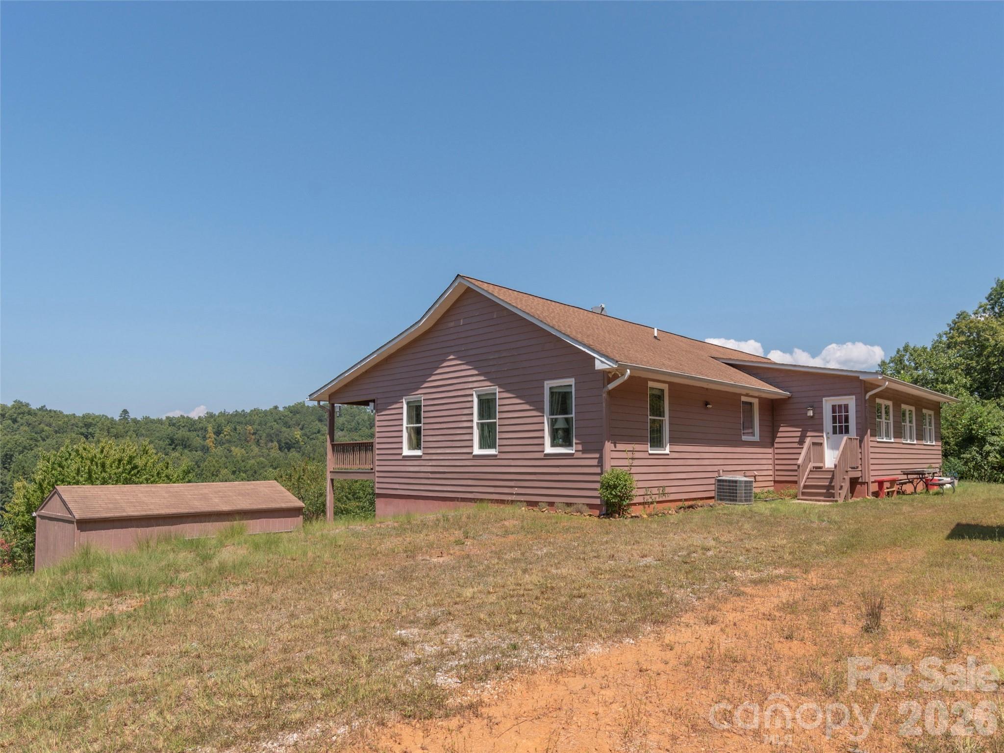 1120 Jacobs Branch Road Franklin, NC 28734 - Photo 34 of 36 a front view of a house with a yard and trees