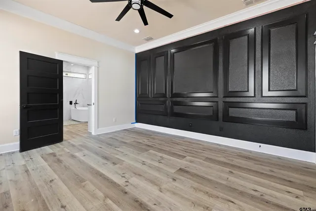 a view of an empty room with a closet