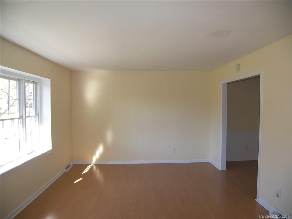 6200 Running Deer Road Charlotte, NC 28214 - Photo 2 of 17 an empty room with windows