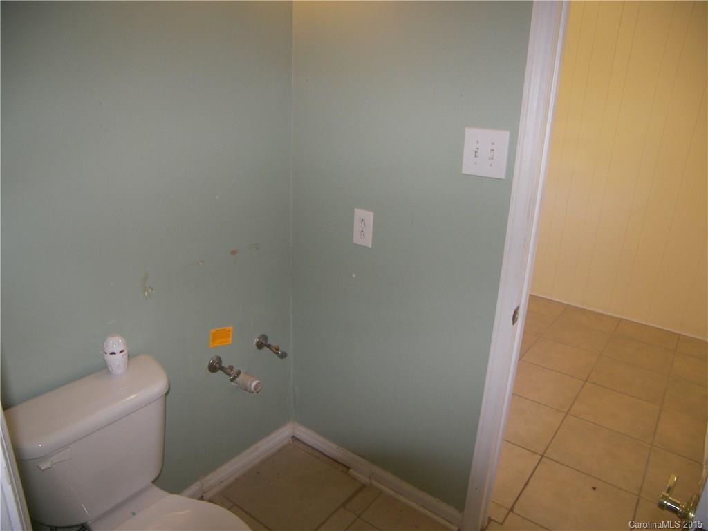6200 Running Deer Road Charlotte, NC 28214 - Photo 11 of 17 a bathroom with a sink and toilet