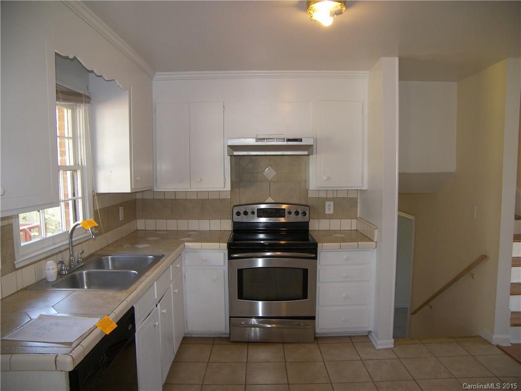 6200 Running Deer Road Charlotte, NC 28214 - Photo 4 of 17 a kitchen with a stove and a sink