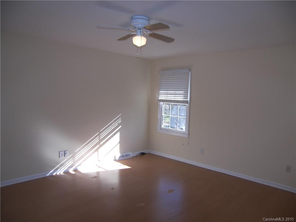 6200 Running Deer Road Charlotte, NC 28214 - Photo 5 of 17 a view of an empty room with a window