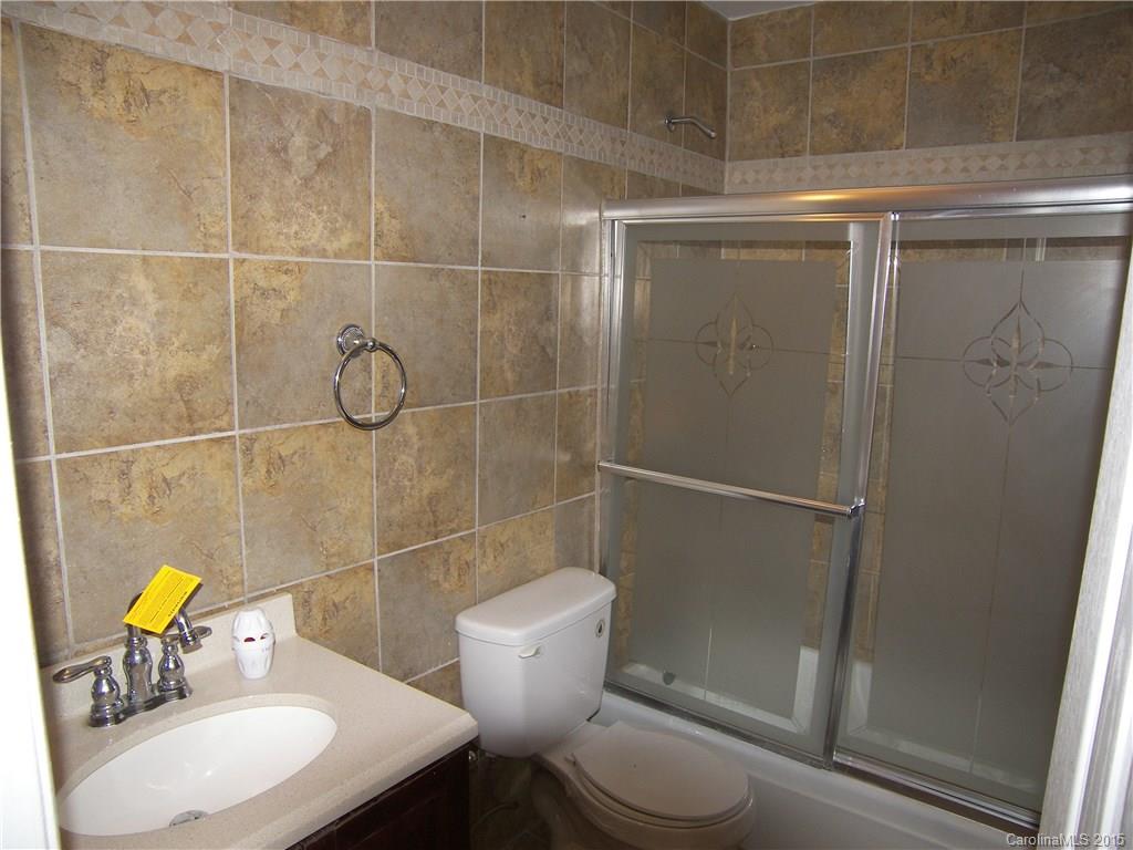 6200 Running Deer Road Charlotte, NC 28214 - Photo 9 of 17 a bathroom with a sink toilet and shower