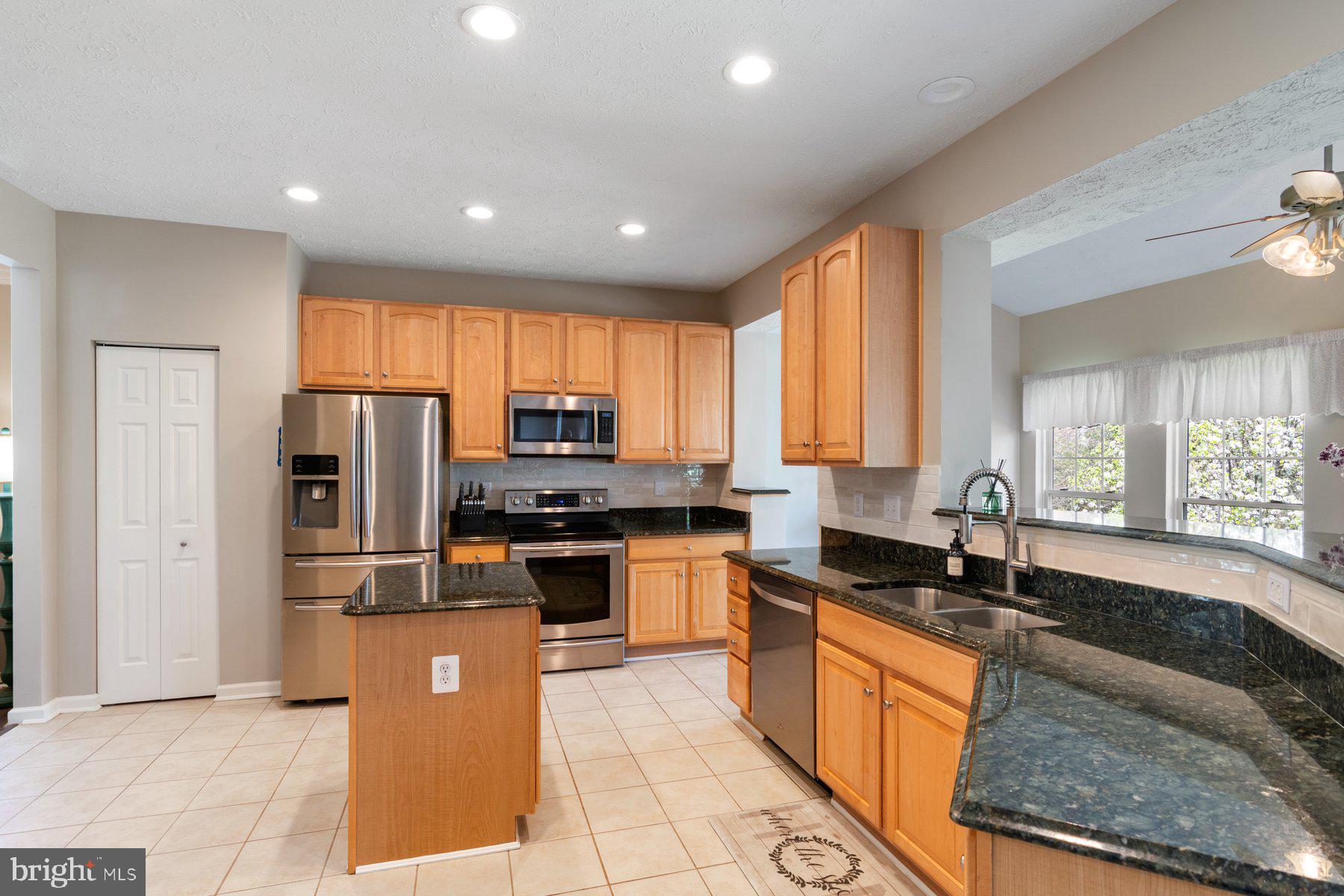 436 Spry Island Road Joppa, MD 21085 - Photo 4 of 37 Kitchen Opening to Sunroom