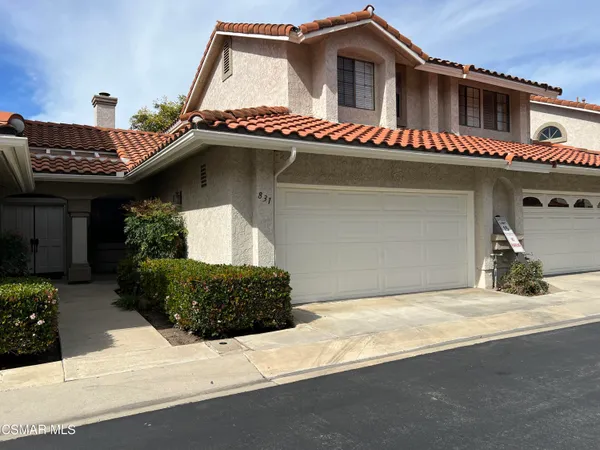 a front view of a house with a garage
