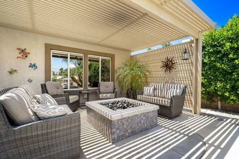 a outdoor living space with furniture and garden view