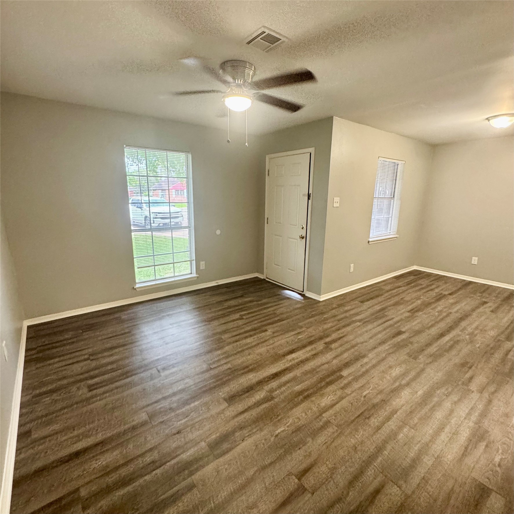 11803 Edgar Street Houston, TX 77047 - Photo 2 of 14 wooden floor in an empty room with a window