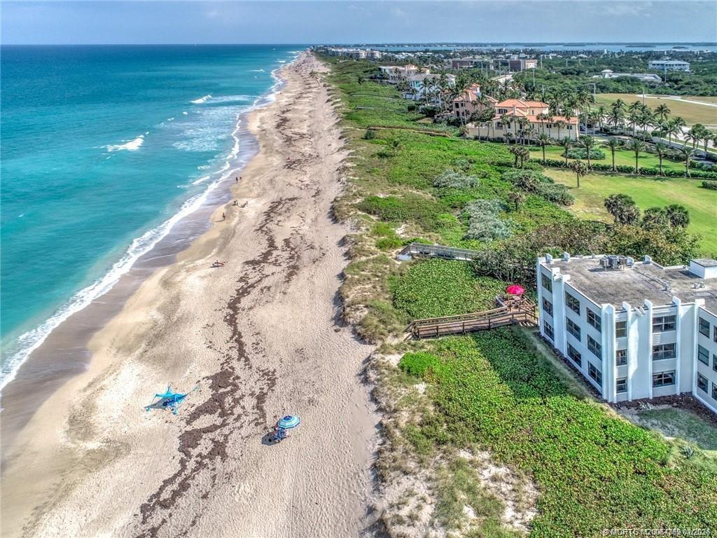 1289 Northeast Ocean Boulevard, Unit 6 Stuart, FL 34996 - Photo 38 of 55 a view of a lake with a yard
