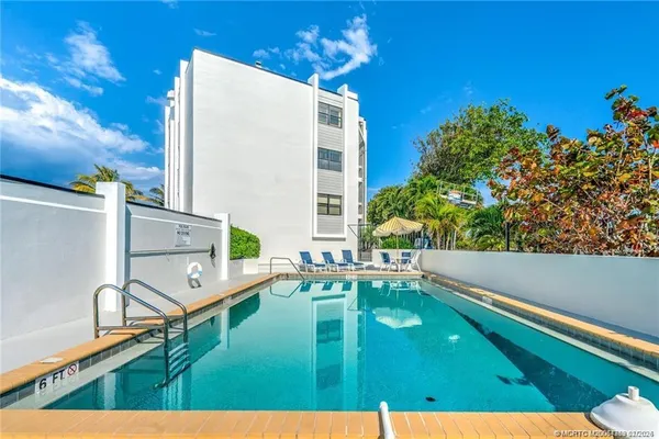 a view of swimming pool with a balcony