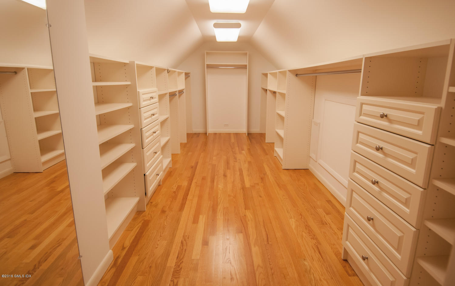 4 Ridgebrook Road Greenwich, CT 06830 - Photo 11 of 17 a view of walk in closet with empty racks
