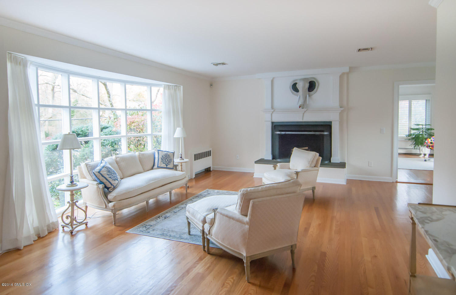 4 Ridgebrook Road Greenwich, CT 06830 - Photo 2 of 17 a living room with furniture and a fireplace