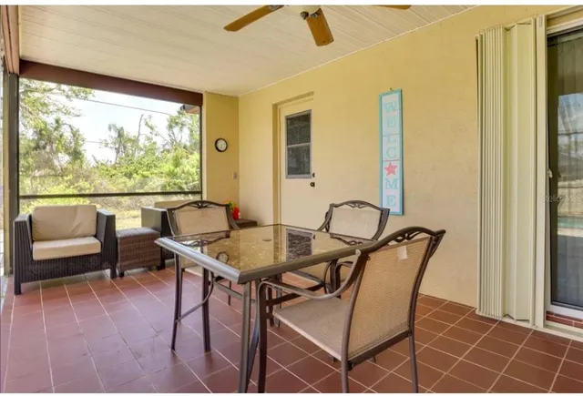 a dining room with furniture and window
