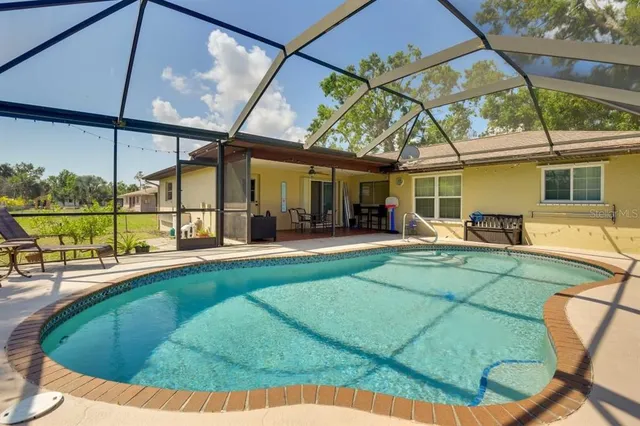 a view of a house with backyard porch and patio