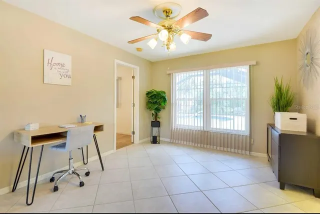 a view of an empty room with a window