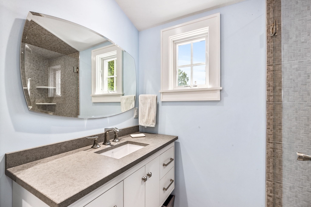 17 Pleasant Street Hingham, MA 02043 - Photo 11 of 41 a bathroom with a sink vanity granite and a mirror