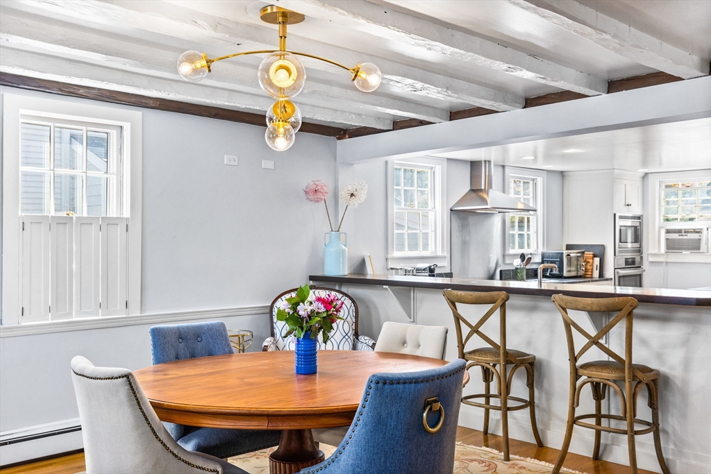 17 Pleasant Street Hingham, MA 02043 - Photo 15 of 41 a view of a dining room with furniture and a chandelier