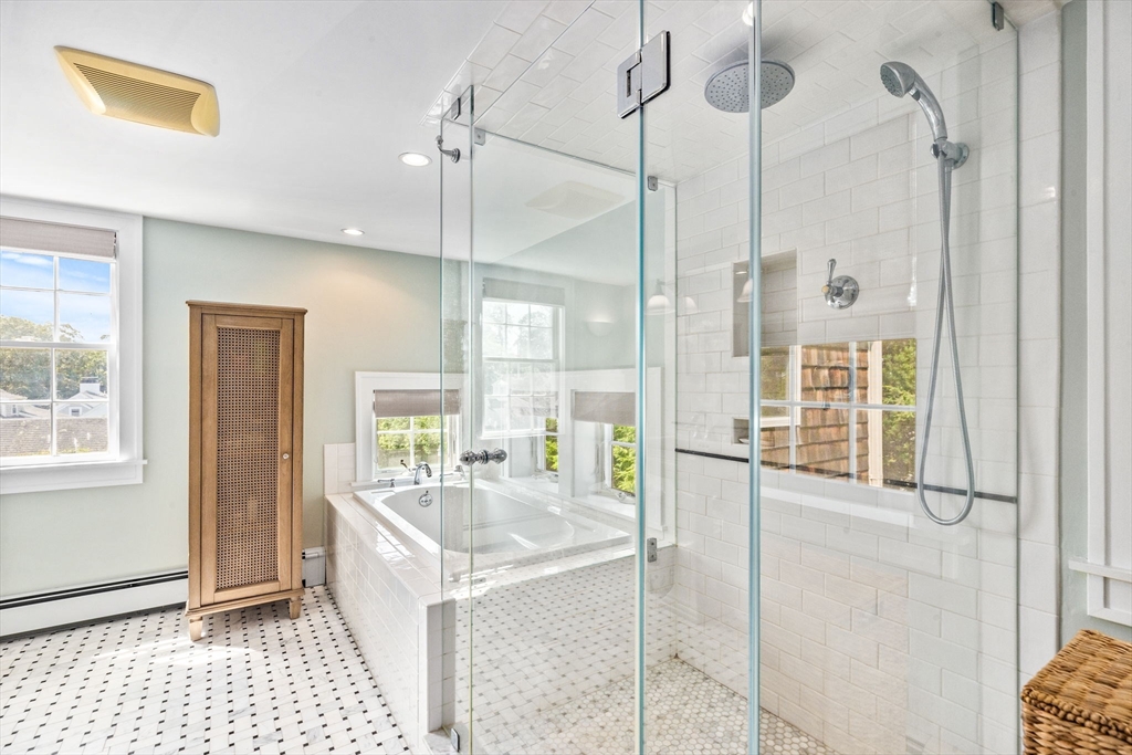 17 Pleasant Street Hingham, MA 02043 - Photo 23 of 41 a bathroom with a tub shower and mirror