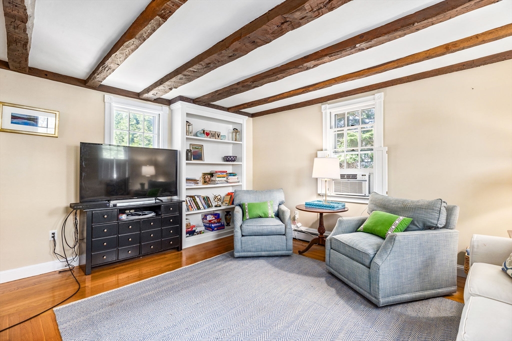 17 Pleasant Street Hingham, MA 02043 - Photo 32 of 41 a living room with furniture and a flat screen tv