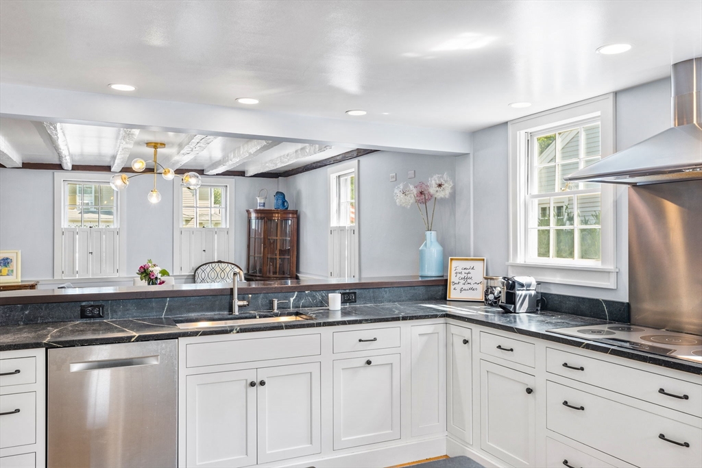 17 Pleasant Street Hingham, MA 02043 - Photo 7 of 41 a bathroom with a granite countertop sink mirror and cabinets