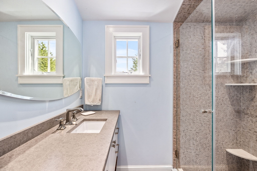 17 Pleasant Street Hingham, MA 02043 - Photo 10 of 41 a bathroom with a sink vanity granite tub and shower