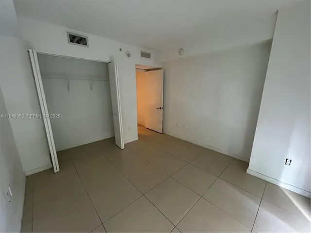 an empty room with a mirror