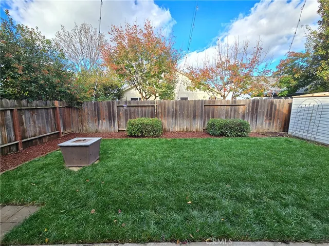 a view of a backyard with a swing