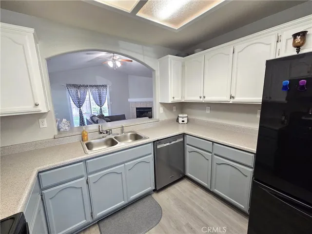 a kitchen with cabinets and white appliances