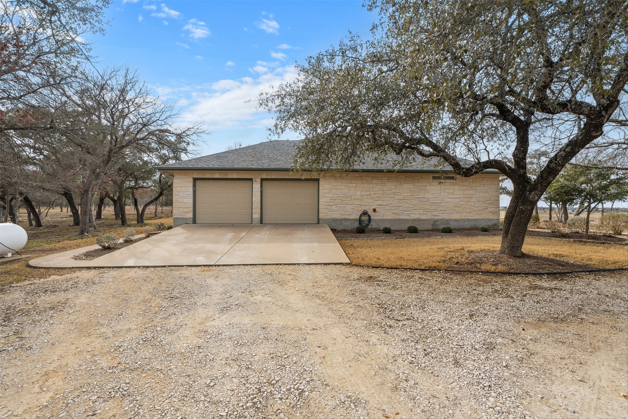 420 Rundberg Drive Jarrell, TX 76537 - Photo 24 of 28 View of side garage access and driveway