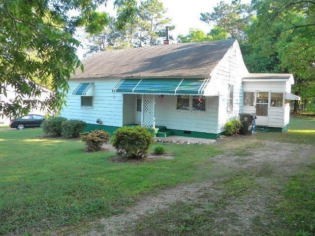 2610 Layden Street Raleigh, NC 27603 - Photo 1 of 11 Cute Bungalow with side porch and fenced yard. Exterior Front