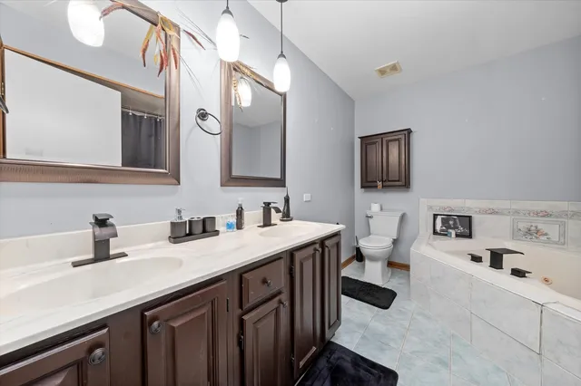 a kitchen with a sink a stove and cabinets