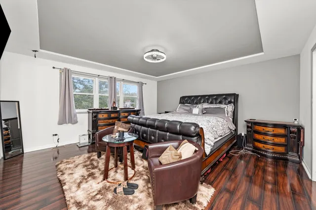 a bedroom with furniture and a window