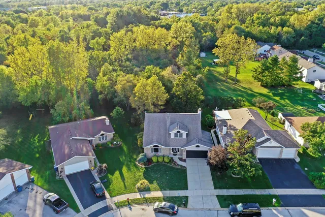 an aerial view of house with yard swimming pool and outdoor seating