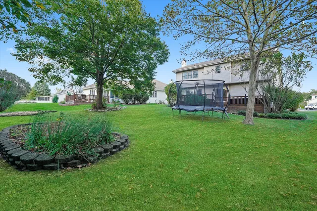 a view of a house with a yard porch and sitting area
