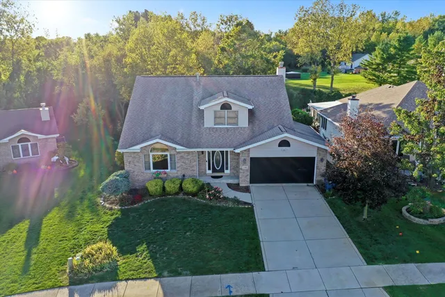 a aerial view of house with a yard