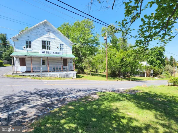 a front view of house with yard and swimming pool