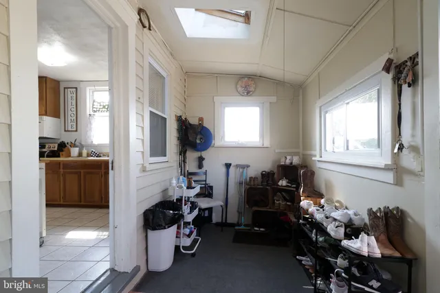 a bedroom with a bed and lamp