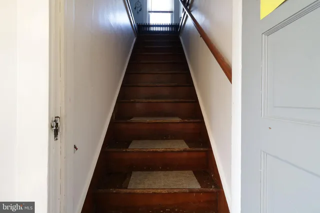 a living room with lots of furniture and a window